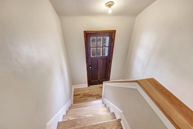 interior space with baseboards and hardwood / wood-style floors