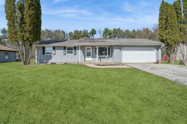 ranch-style house featuring a garage, a front lawn, and driveway