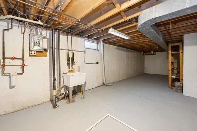 basement featuring electric panel