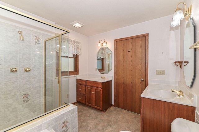 full bathroom with visible vents, vanity, and a shower stall