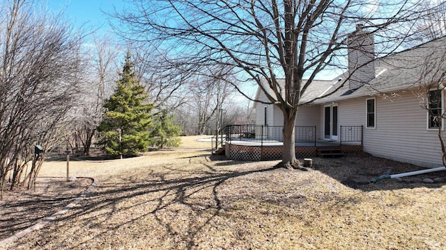 view of yard with a wooden deck