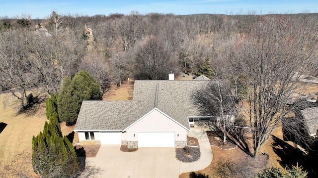 bird's eye view featuring a view of trees