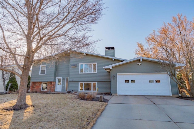 view of front of property with central AC, concrete driveway, a chimney, and an attached garage