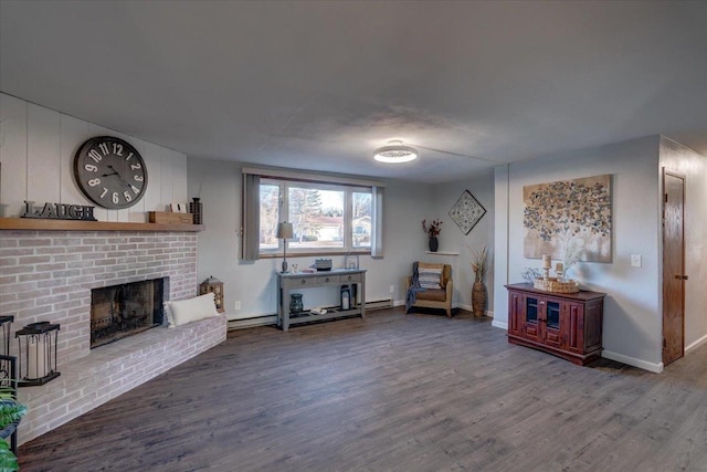 unfurnished living room featuring a fireplace, wood finished floors, baseboards, and a baseboard radiator