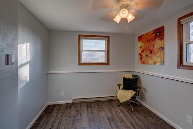 unfurnished room with baseboards, wood finished floors, a ceiling fan, and a baseboard radiator