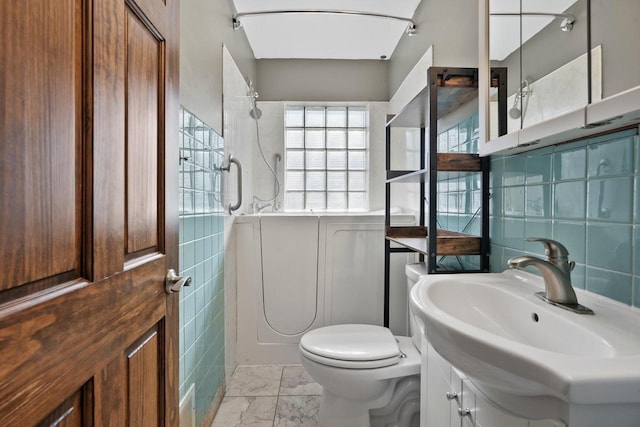 full bathroom featuring walk in shower, tile walls, toilet, and marble finish floor