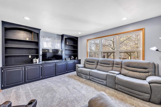 carpeted living area featuring recessed lighting