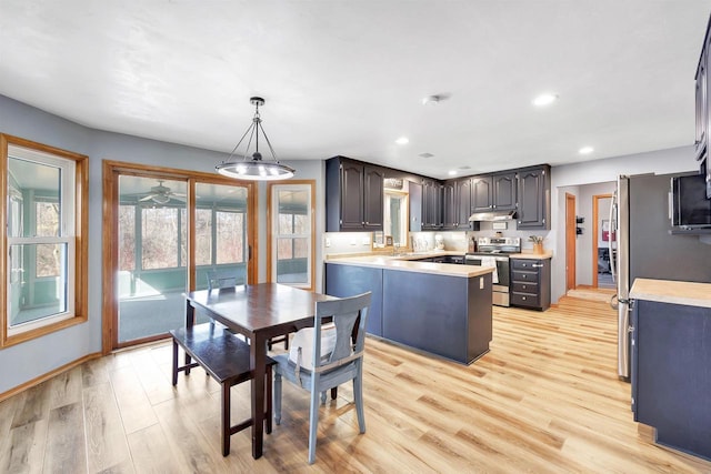 dining area with recessed lighting, light wood-type flooring, baseboards, and a ceiling fan