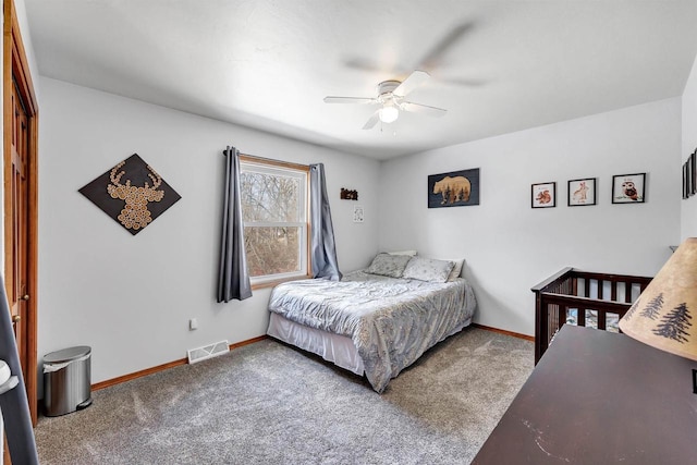 bedroom featuring visible vents, baseboards, carpet, and ceiling fan