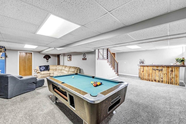 game room with baseboards, a drop ceiling, carpet floors, a bar, and billiards