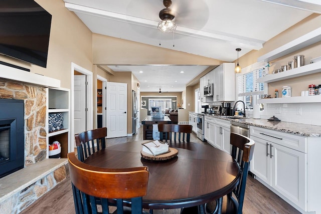 dining room with recessed lighting, lofted ceiling with beams, dark wood-type flooring, and a ceiling fan