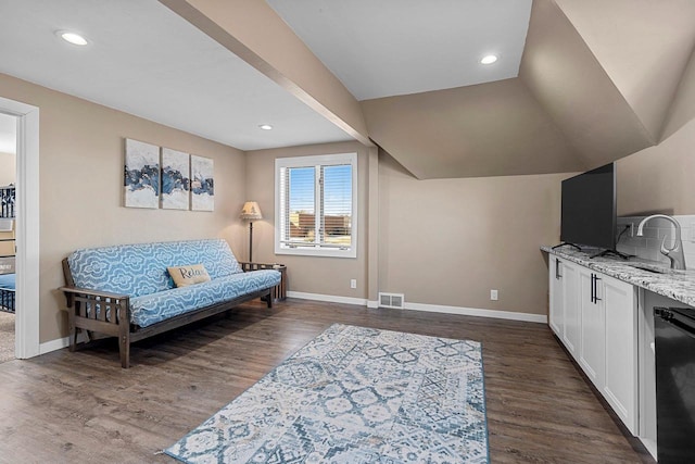 sitting room featuring dark wood finished floors, baseboards, and visible vents