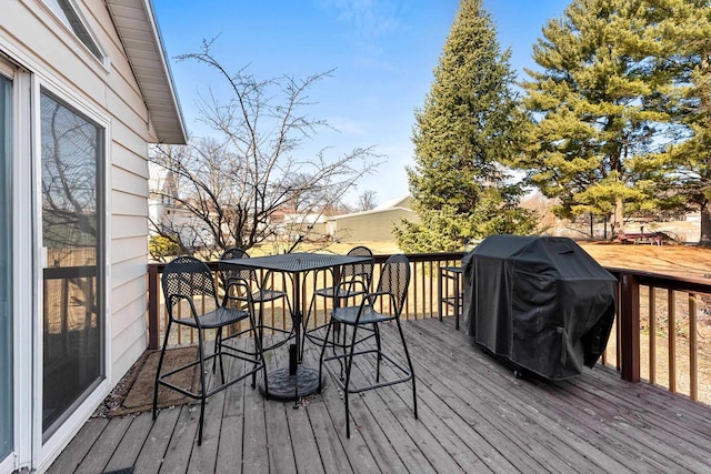 wooden terrace featuring area for grilling