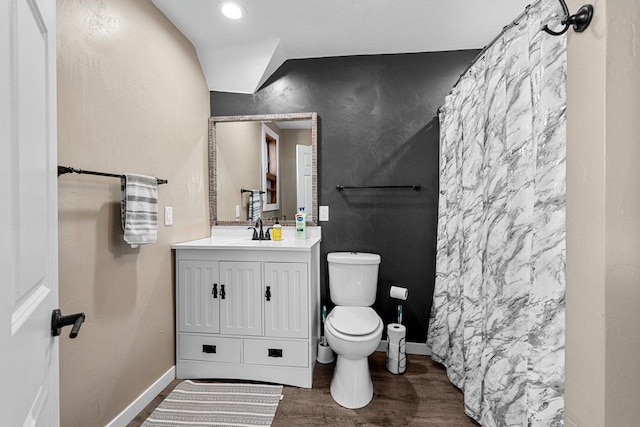 full bath featuring baseboards, toilet, a shower with shower curtain, wood finished floors, and vanity