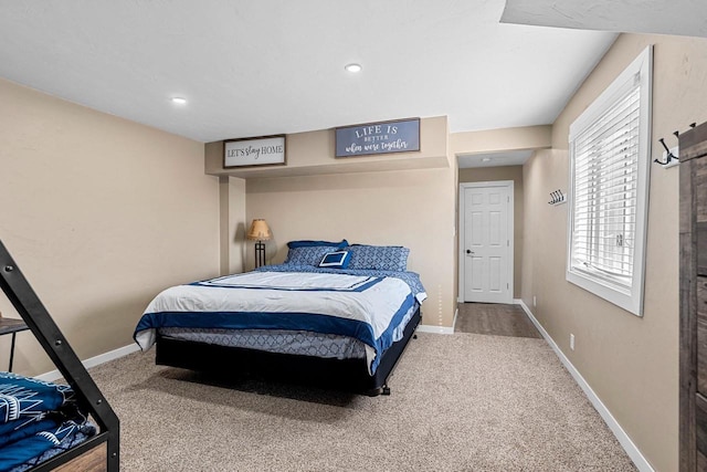 carpeted bedroom featuring recessed lighting and baseboards