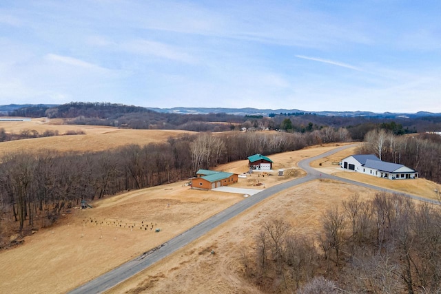 drone / aerial view featuring a rural view and a mountain view