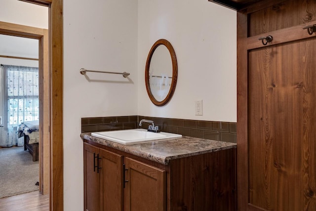 ensuite bathroom featuring connected bathroom and vanity