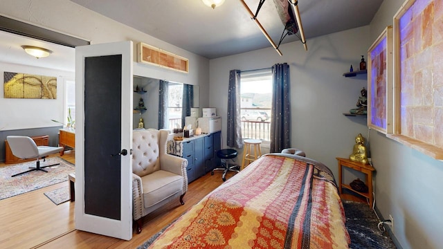 bedroom with light wood-type flooring