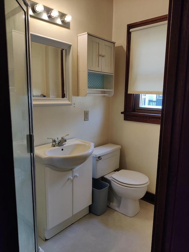 bathroom with toilet and vanity