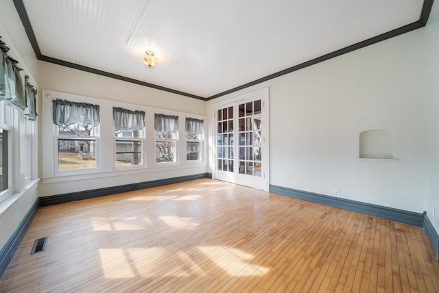 unfurnished sunroom with visible vents