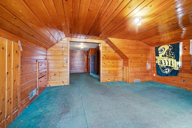 additional living space with wooden walls, wood ceiling, and lofted ceiling