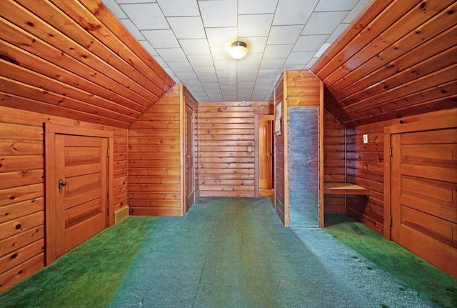 bonus room with wooden ceiling, lofted ceiling, wood walls, and carpet flooring