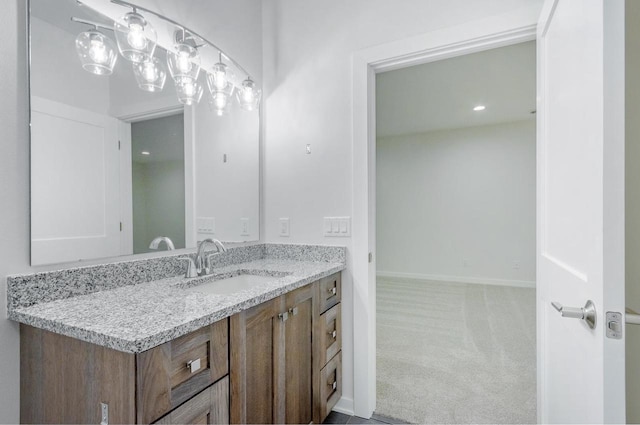 bathroom featuring vanity and baseboards