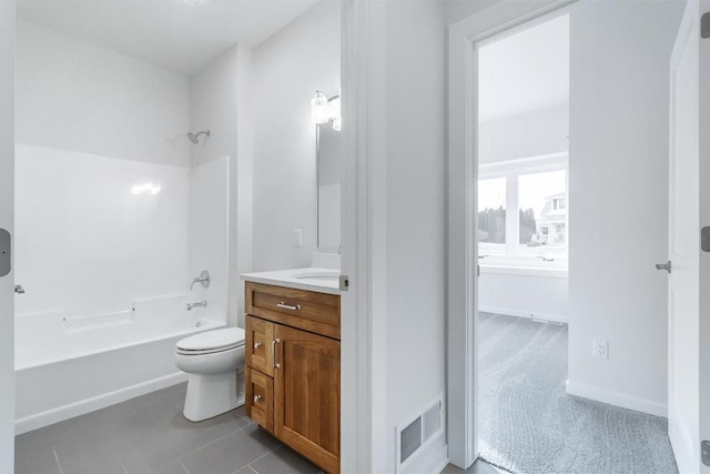 full bathroom with visible vents, baseboards, toilet, vanity, and  shower combination