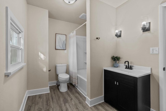 full bath featuring toilet, wood finished floors, shower / bath combination with curtain, baseboards, and vanity