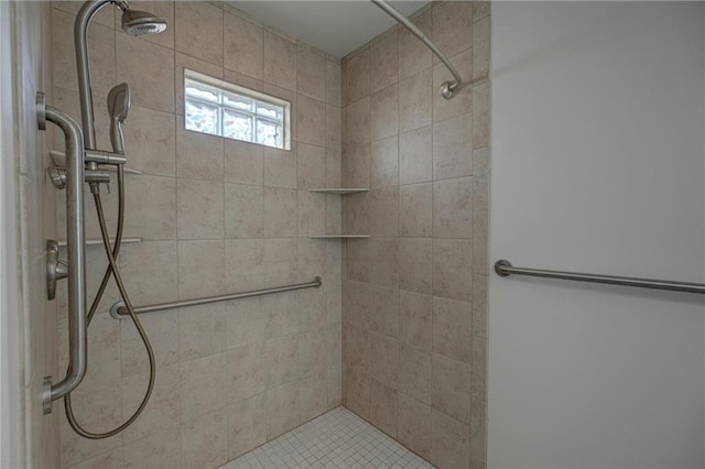 full bathroom with tiled shower