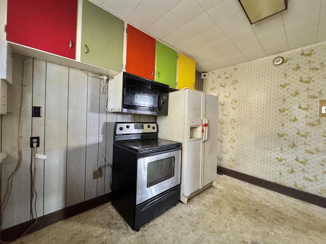 kitchen with light floors, electric stove, black microwave, and white fridge with ice dispenser