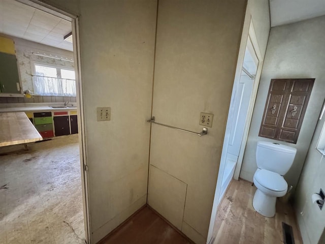 bathroom with toilet and a sink