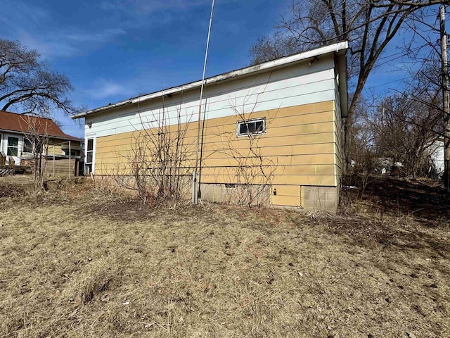 view of side of home featuring crawl space