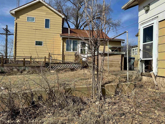 rear view of house with fence