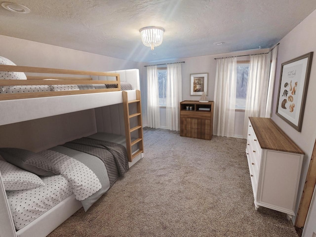 bedroom with a textured ceiling and light carpet