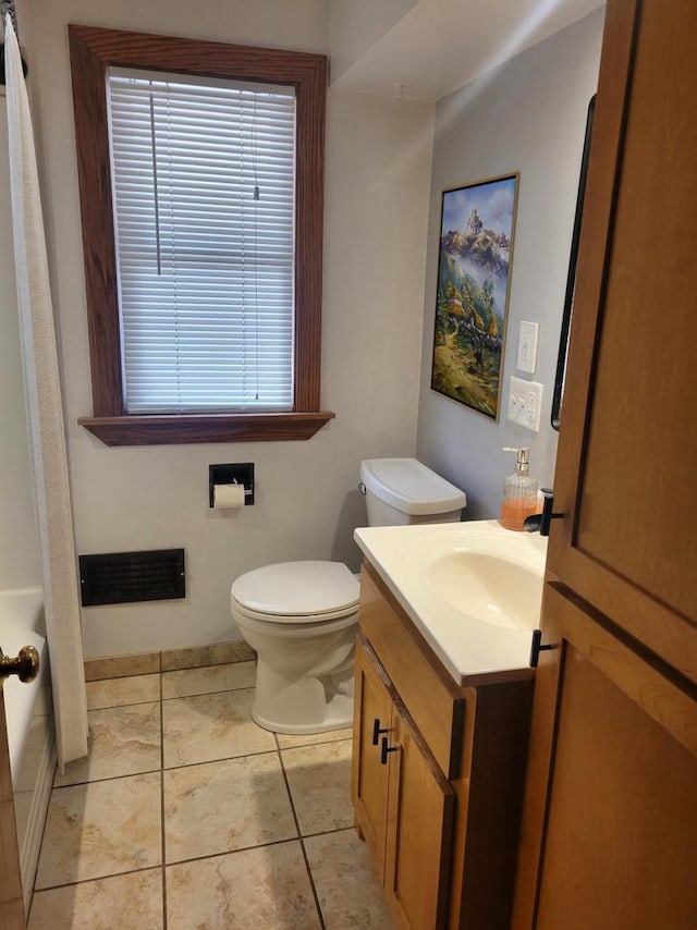 full bath featuring vanity, tile patterned floors, toilet, and visible vents