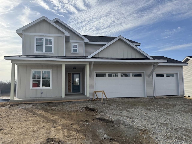 view of front of house featuring driveway, a porch, an attached garage, a shingled roof, and board and batten siding