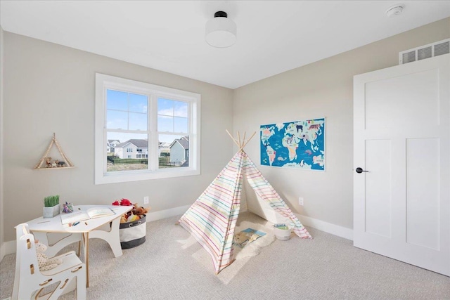 playroom with visible vents, baseboards, and carpet flooring