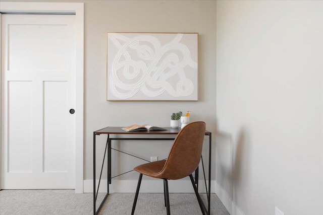 office area featuring baseboards and carpet floors