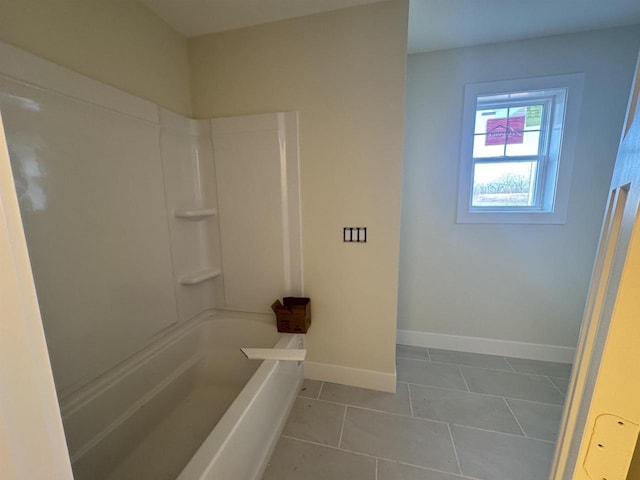 full bathroom with tile patterned flooring, shower / bathing tub combination, and baseboards