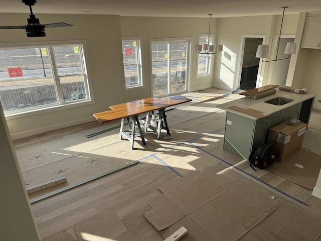 dining area with baseboards and a chandelier