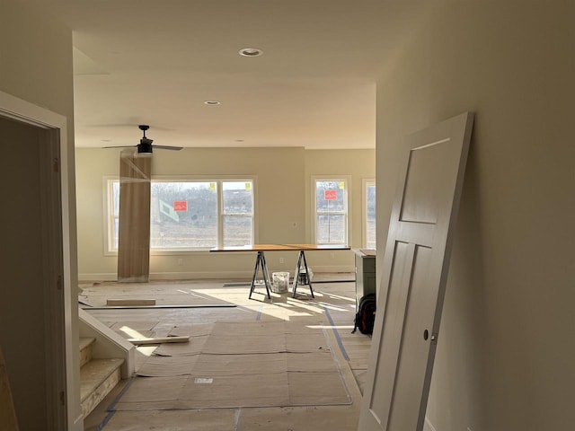 corridor featuring recessed lighting and baseboards