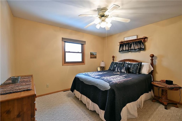 carpeted bedroom with baseboards and a ceiling fan