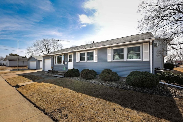 ranch-style house with a garage and concrete driveway