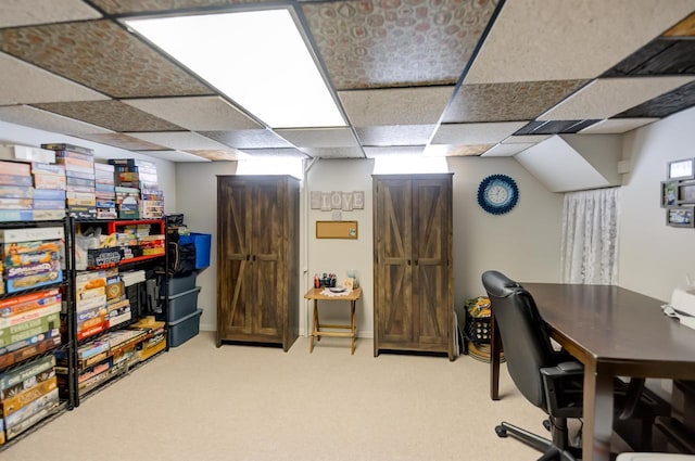 home office with a paneled ceiling and carpet floors