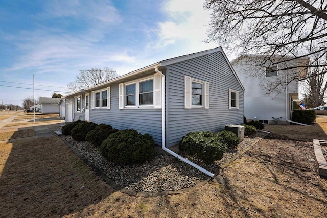 view of side of home featuring a garage