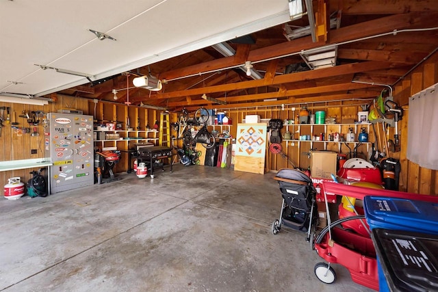 garage featuring a workshop area and a garage door opener