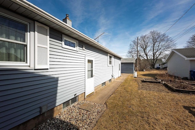 view of property exterior featuring a chimney