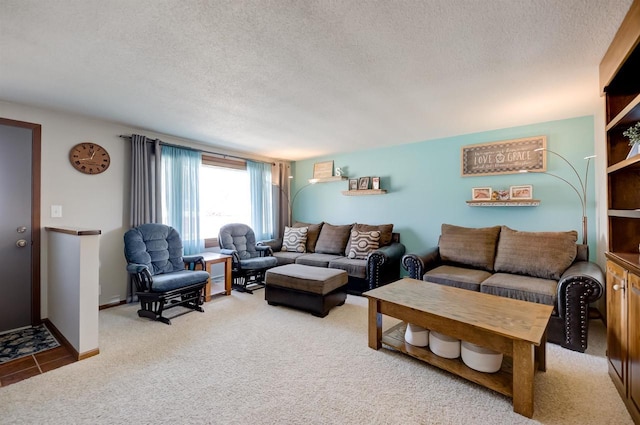 carpeted living room featuring a textured ceiling and baseboards