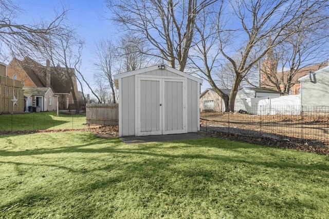 view of shed with fence